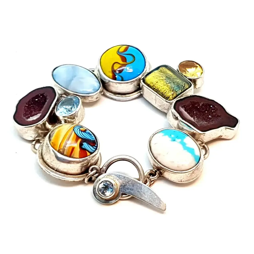 Original and special silver bracelet with enamel and different natural stones.